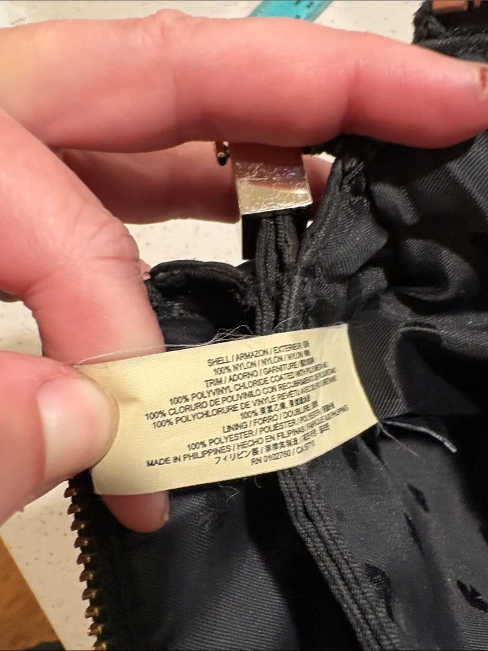 kate spade black crossbody pouch with gold-tone logo